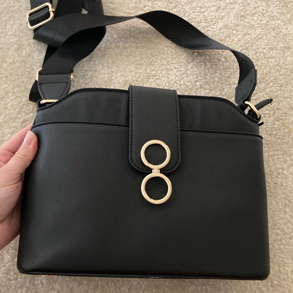 Elegant Black Handbag with Gold Accents